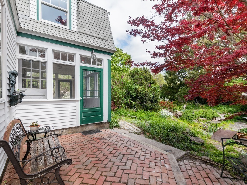 17 Clinton Street Hopkinton, MA 01748 - Photo 21 of 27 a front view of a house with garden