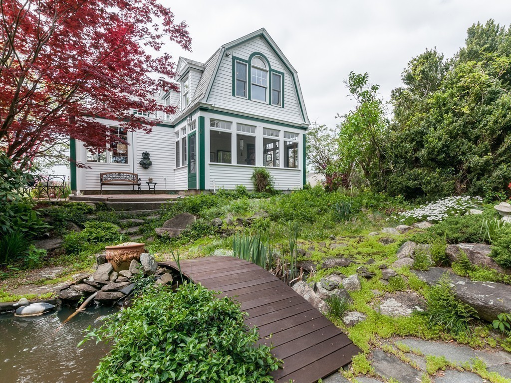 17 Clinton Street Hopkinton, MA 01748 - Photo 22 of 27 a front view of a house with a yard