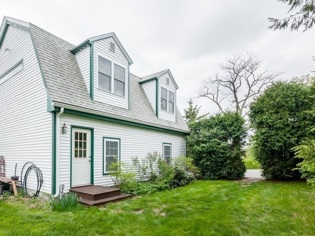 17 Clinton Street Hopkinton, MA 01748 - Photo 25 of 27 a front view of a house with garden