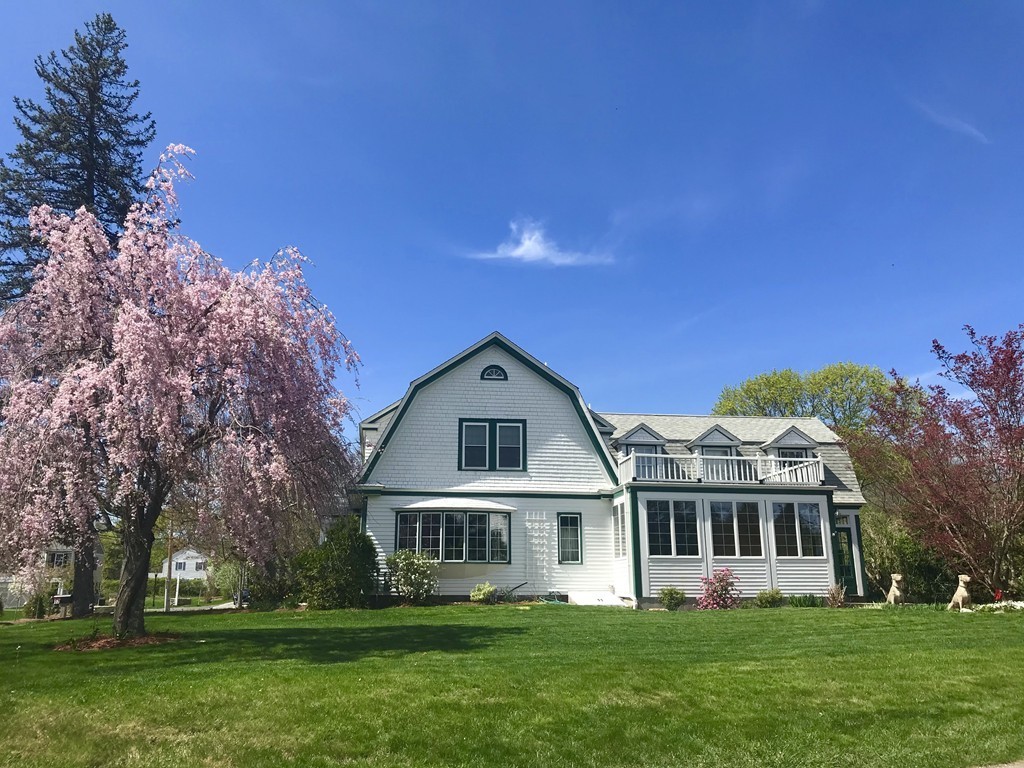 17 Clinton Street Hopkinton, MA 01748 - Photo 3 of 27 a front view of a house with a garden