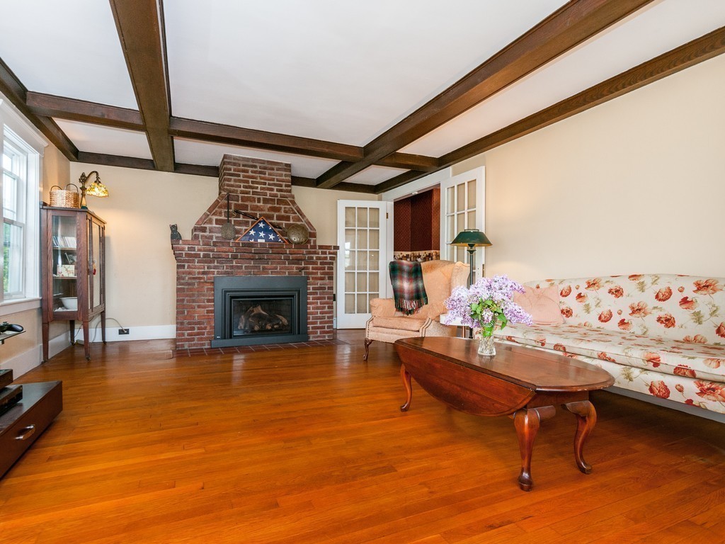 17 Clinton Street Hopkinton, MA 01748 - Photo 5 of 27 a living room with furniture and a fireplace