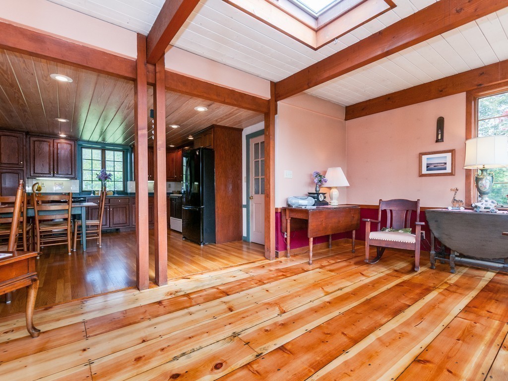 17 Clinton Street Hopkinton, MA 01748 - Photo 7 of 27 a living room with furniture a wooden floor and a large window