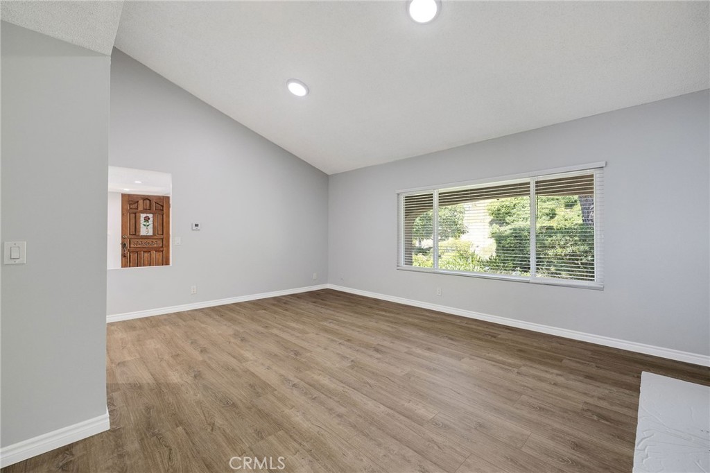 3418 Seaglen Drive Rancho Palos Verdes, CA 90275 - Photo 15 of 42 an empty room with wooden floor and windows