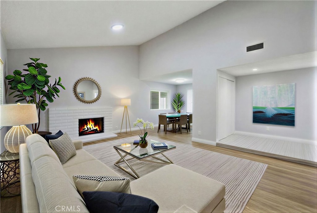 3418 Seaglen Drive Rancho Palos Verdes, CA 90275 - Photo 16 of 42 a living room with furniture a fireplace a potted plant and a fireplace
