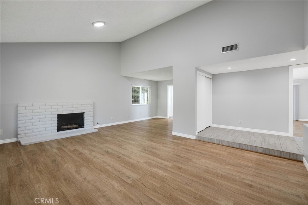 3418 Seaglen Drive Rancho Palos Verdes, CA 90275 - Photo 17 of 42 a view of empty room with wooden floor and fireplace