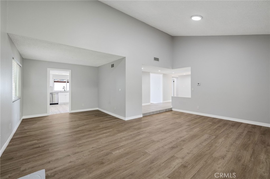 3418 Seaglen Drive Rancho Palos Verdes, CA 90275 - Photo 21 of 42 an empty room with wooden floor and windows