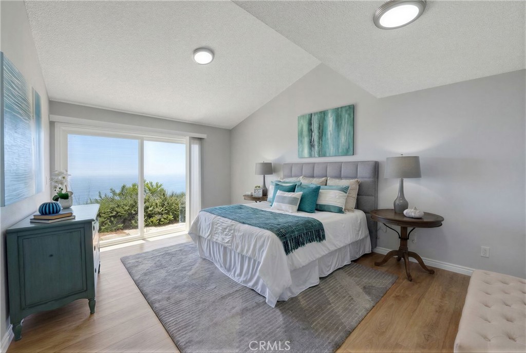 3418 Seaglen Drive Rancho Palos Verdes, CA 90275 - Photo 22 of 42 a bedroom with a large bed and a potted plant