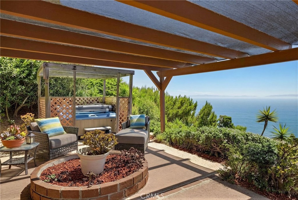 3418 Seaglen Drive Rancho Palos Verdes, CA 90275 - Photo 3 of 42 a patio with a table and chairs and potted plants