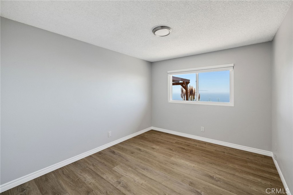 3418 Seaglen Drive Rancho Palos Verdes, CA 90275 - Photo 31 of 42 a view of a room with wooden floor and window