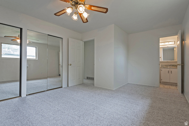 1722 Kimsbrough Road Sandy, UT 84092 - Photo 15 of 29 Spacious room featuring light-colored carpeting, white walls, and a ceiling fan with integrated lighting
