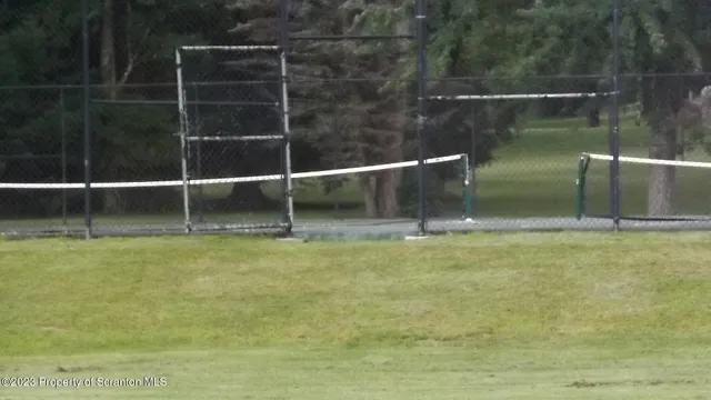 a swimming pool with outdoor seating and plants