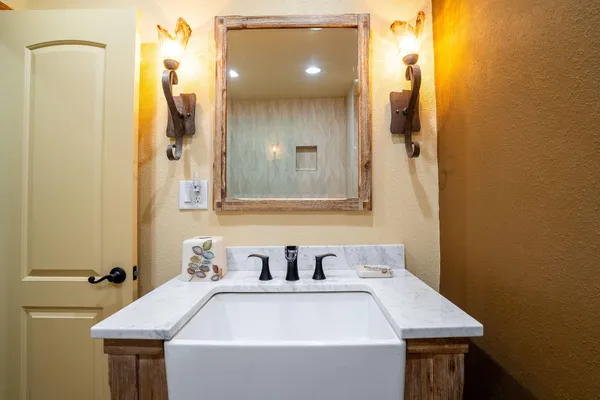 a bathroom with a sink and a mirror
