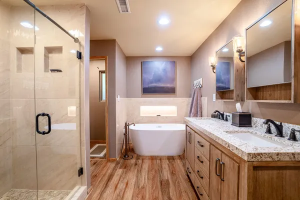 a bathroom with a bathtub and shower