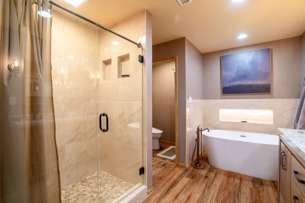a bathroom with a sink vanity and mirror