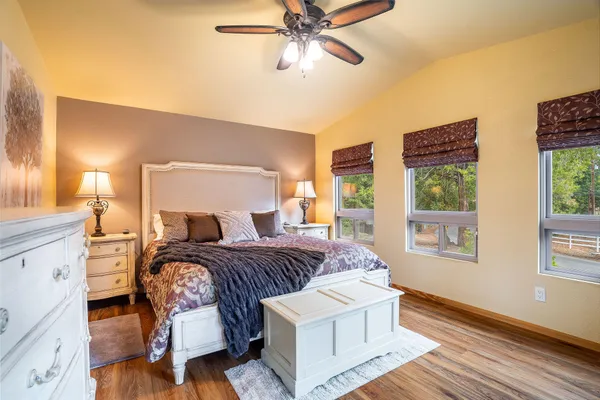 a bedroom with a large bed and a window