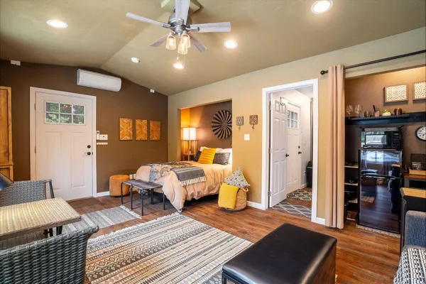 a bedroom with furniture and a chandelier