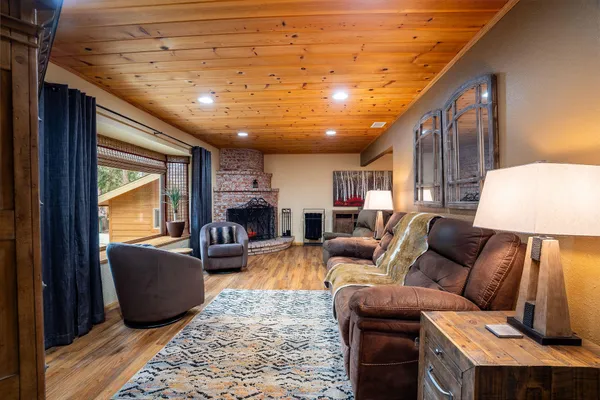 a living room with furniture and a lamp