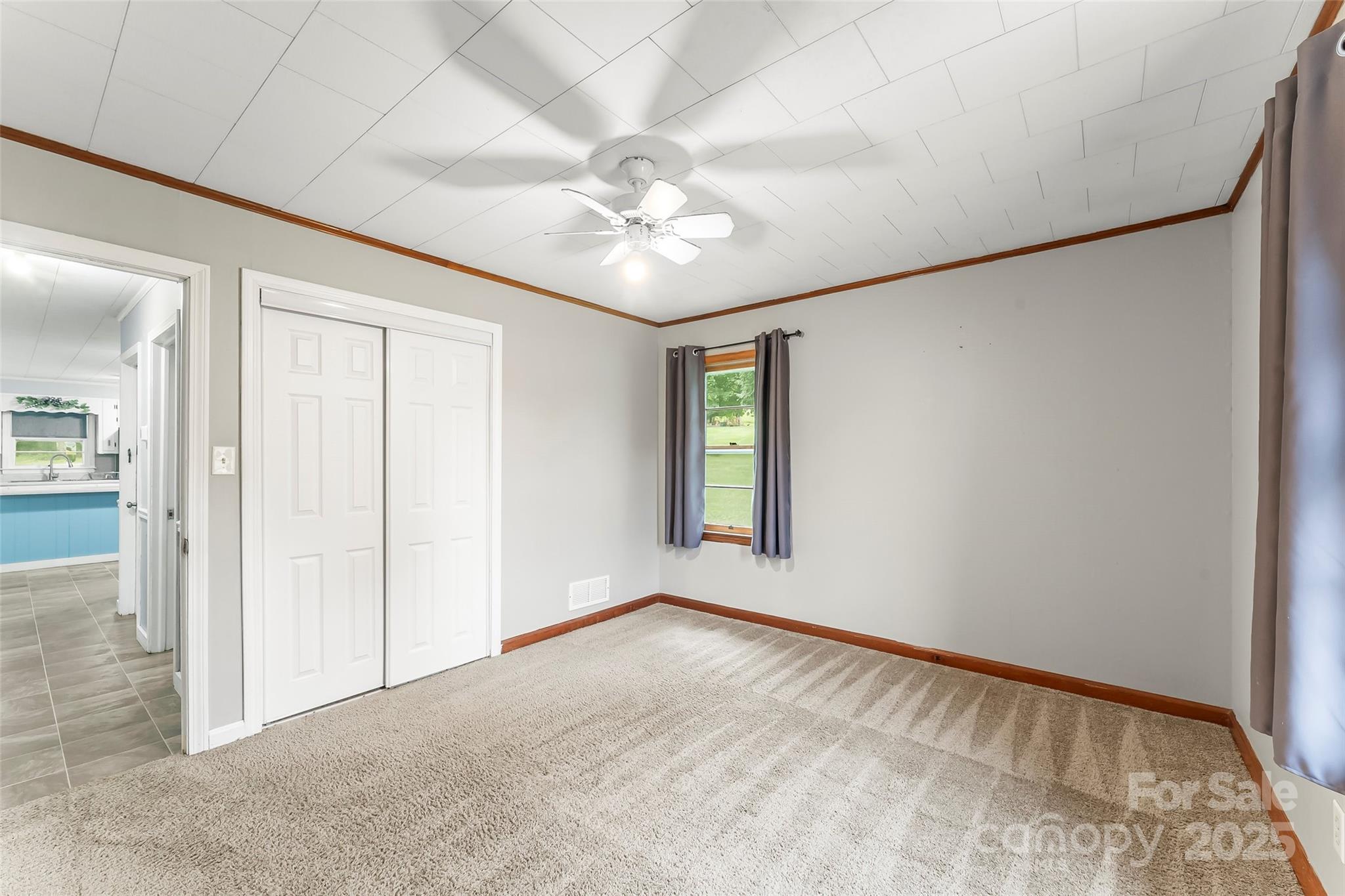 2777 Pax Hill Road Morganton, NC 28655 - Photo 12 of 33 an empty room with fan and windows