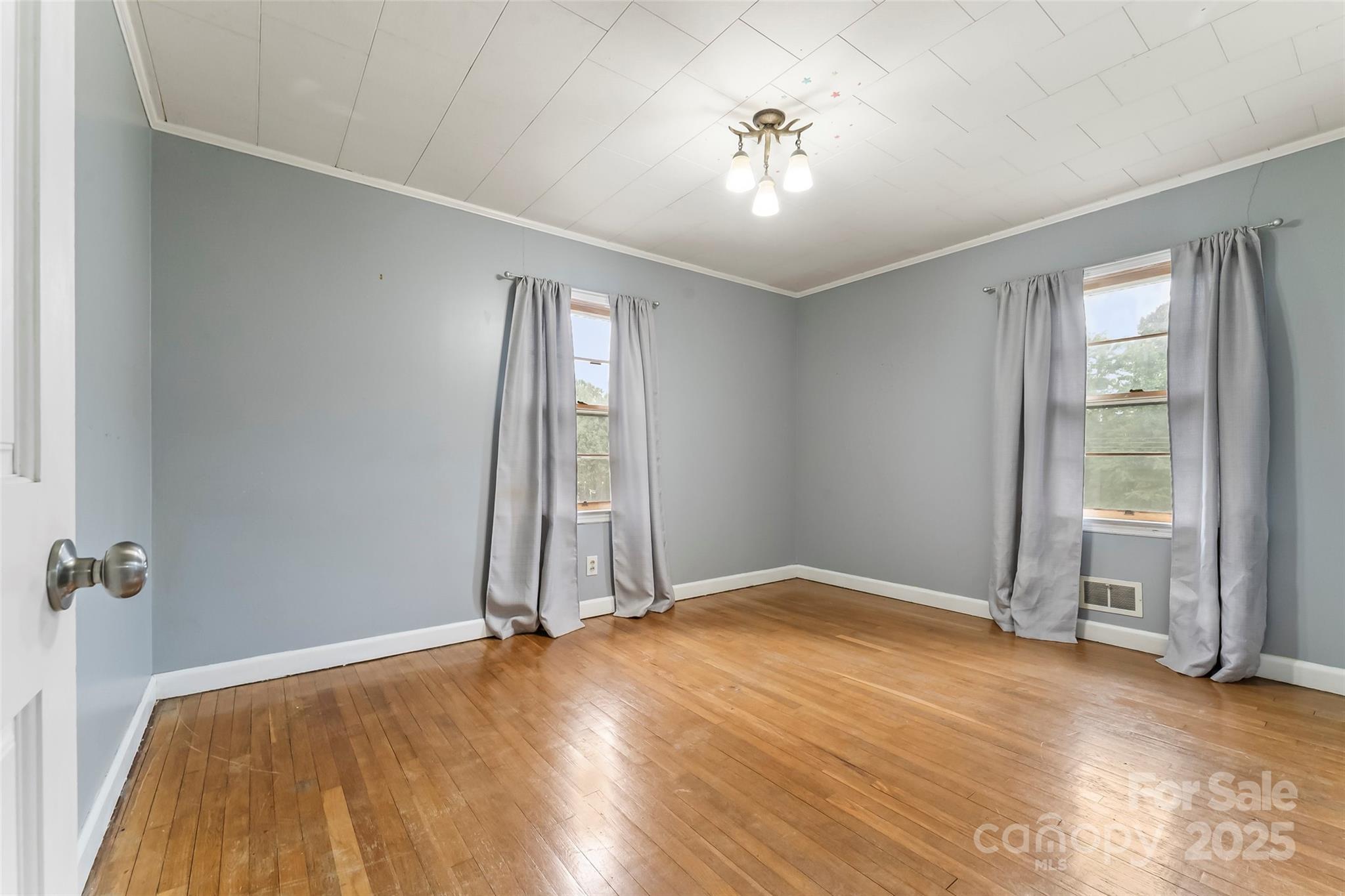 2777 Pax Hill Road Morganton, NC 28655 - Photo 14 of 33 wooden floor in an empty room with a window