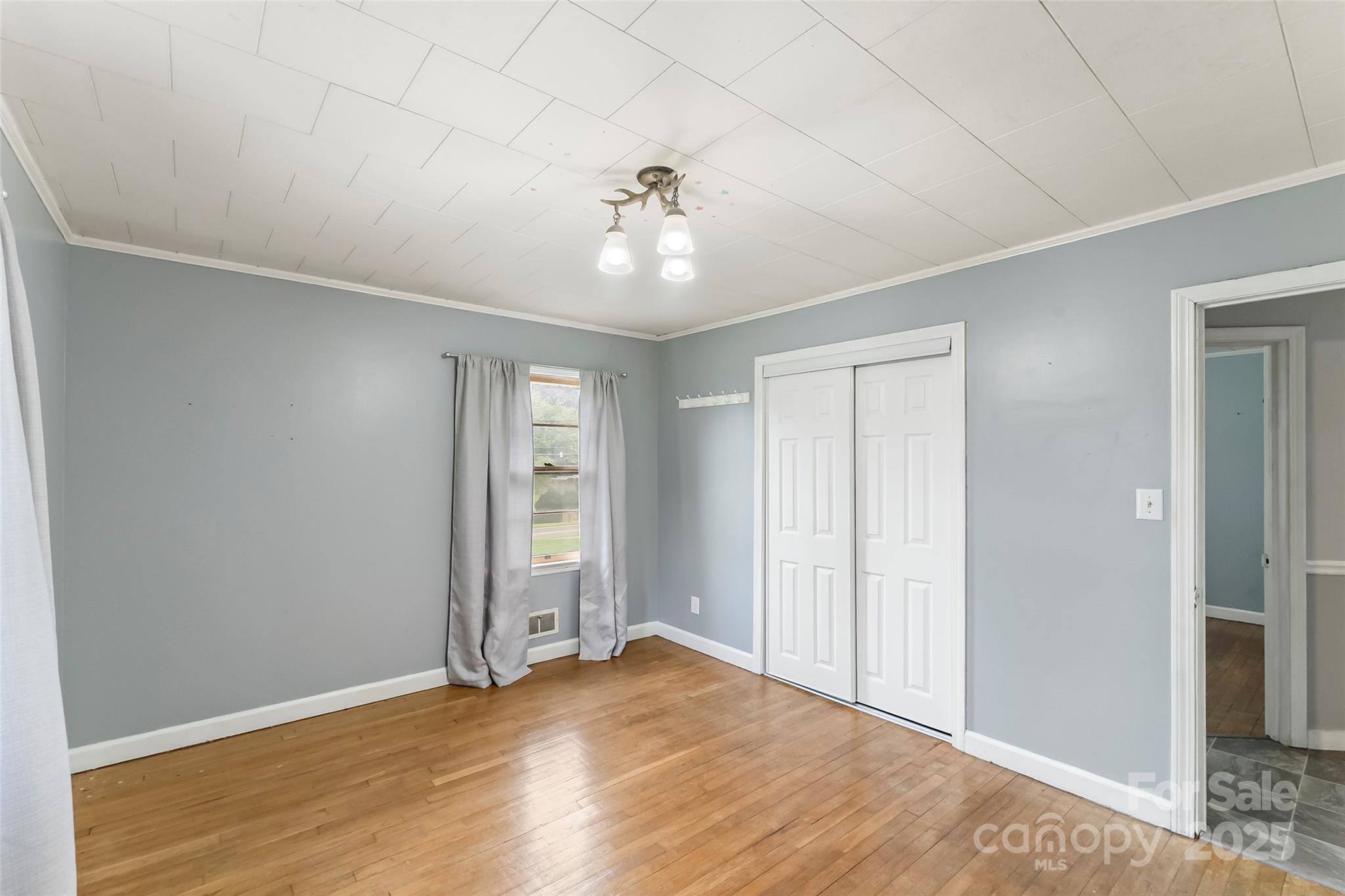 2777 Pax Hill Road Morganton, NC 28655 - Photo 15 of 33 wooden floor in an empty room with a window