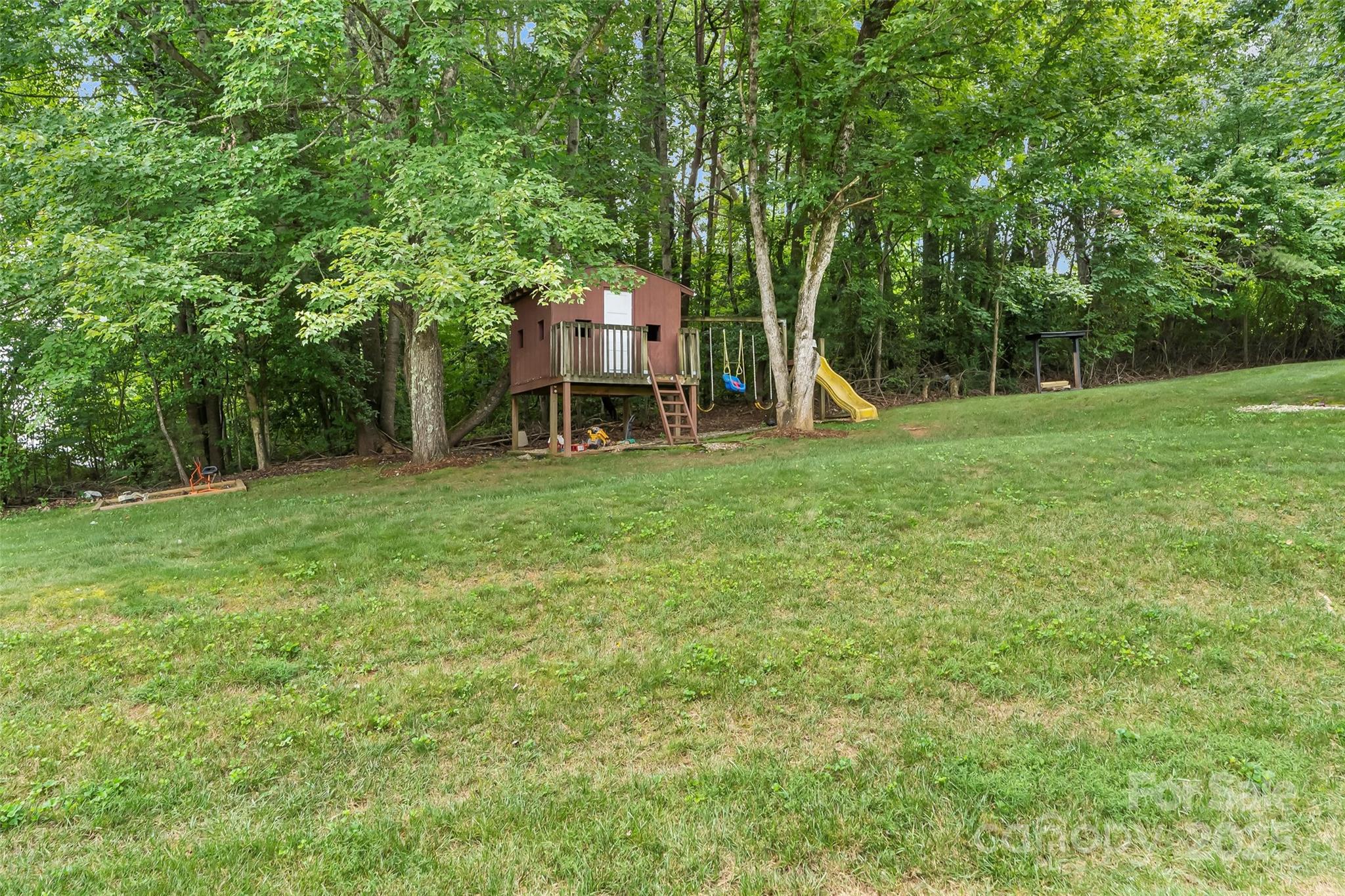 2777 Pax Hill Road Morganton, NC 28655 - Photo 25 of 33 a view of a house with a backyard