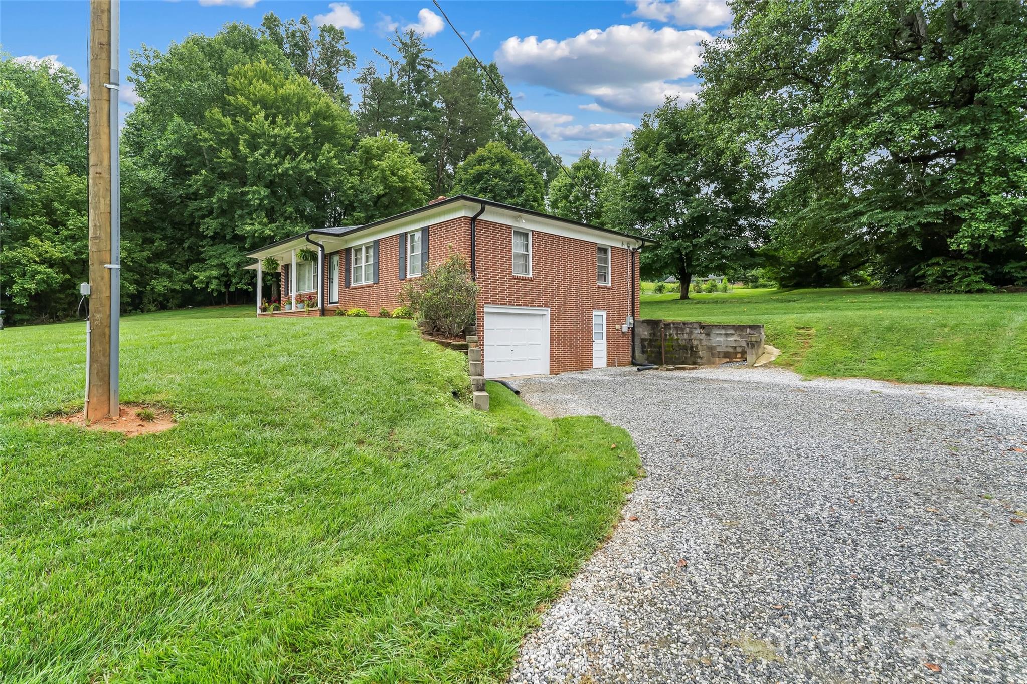 2777 Pax Hill Road Morganton, NC 28655 - Photo 26 of 33 a front view of a house with yard and green space