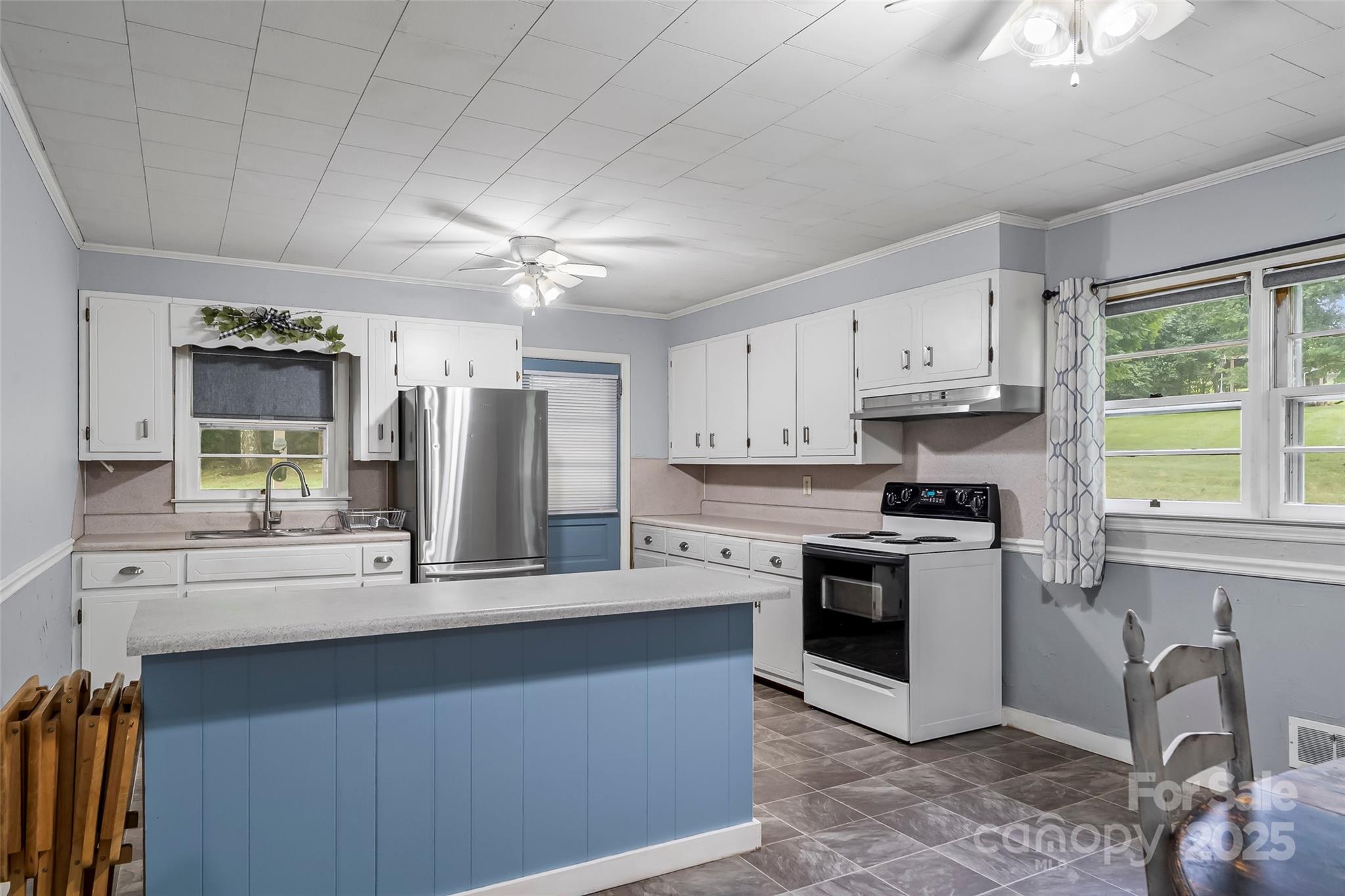 2777 Pax Hill Road Morganton, NC 28655 - Photo 8 of 33 a kitchen with stainless steel appliances granite countertop a stove a sink dishwasher and a refrigerator