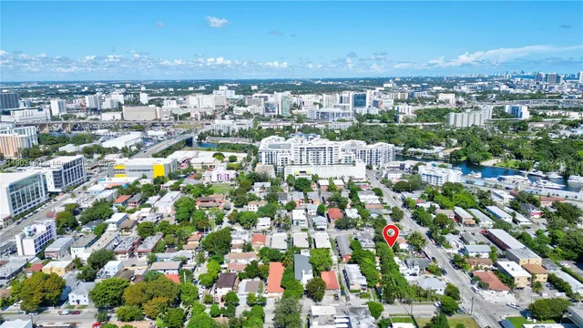 an aerial view of a house with a yard and garden