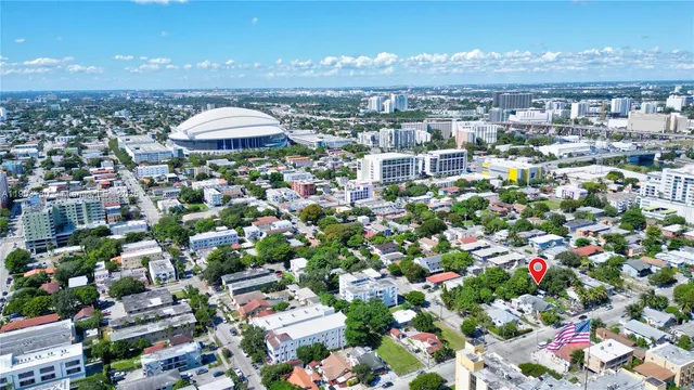 an outdoor space with lots of potted plants