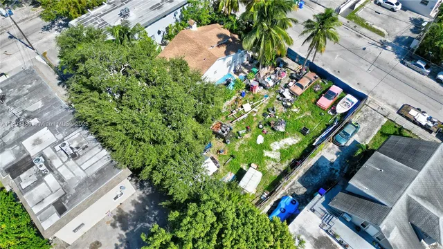an aerial view of a house with an outdoor space