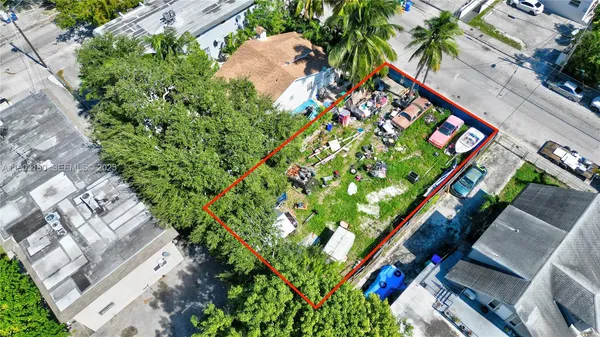 an aerial view of a house with an outdoor space