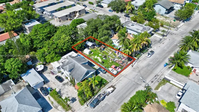 an aerial view of a house with a yard
