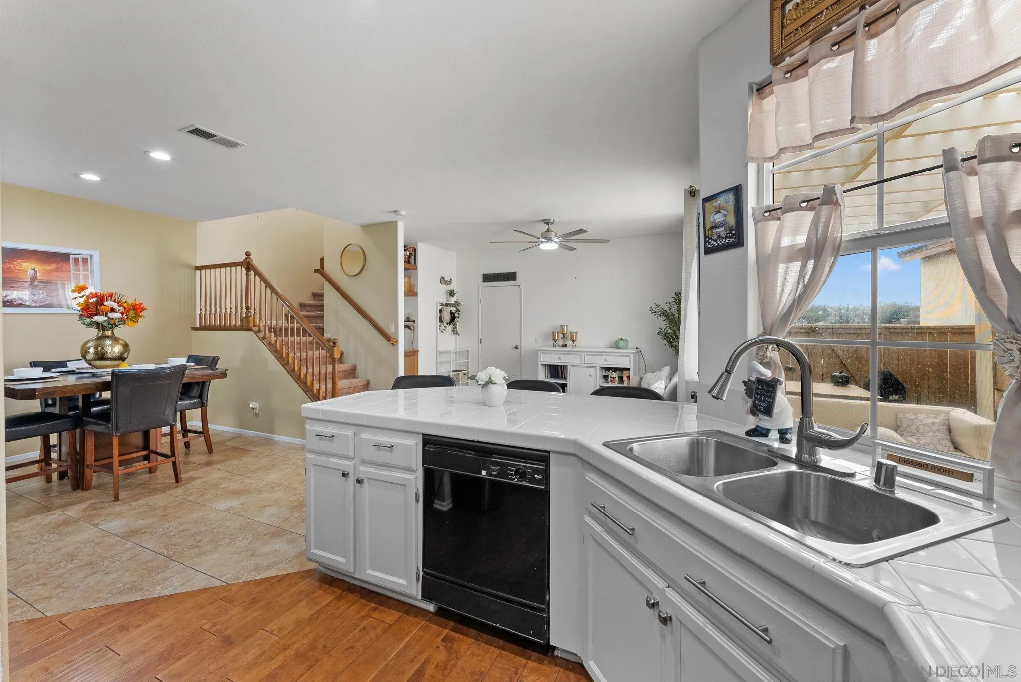 1924 Geyserville Street Chula Vista, CA 91913 - Photo 13 of 37 a kitchen with a sink stove and cabinets