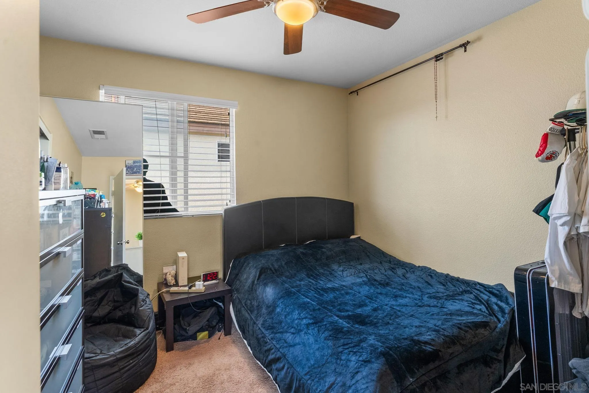 1924 Geyserville Street Chula Vista, CA 91913 - Photo 19 of 37 a bedroom with a bed and a chandelier