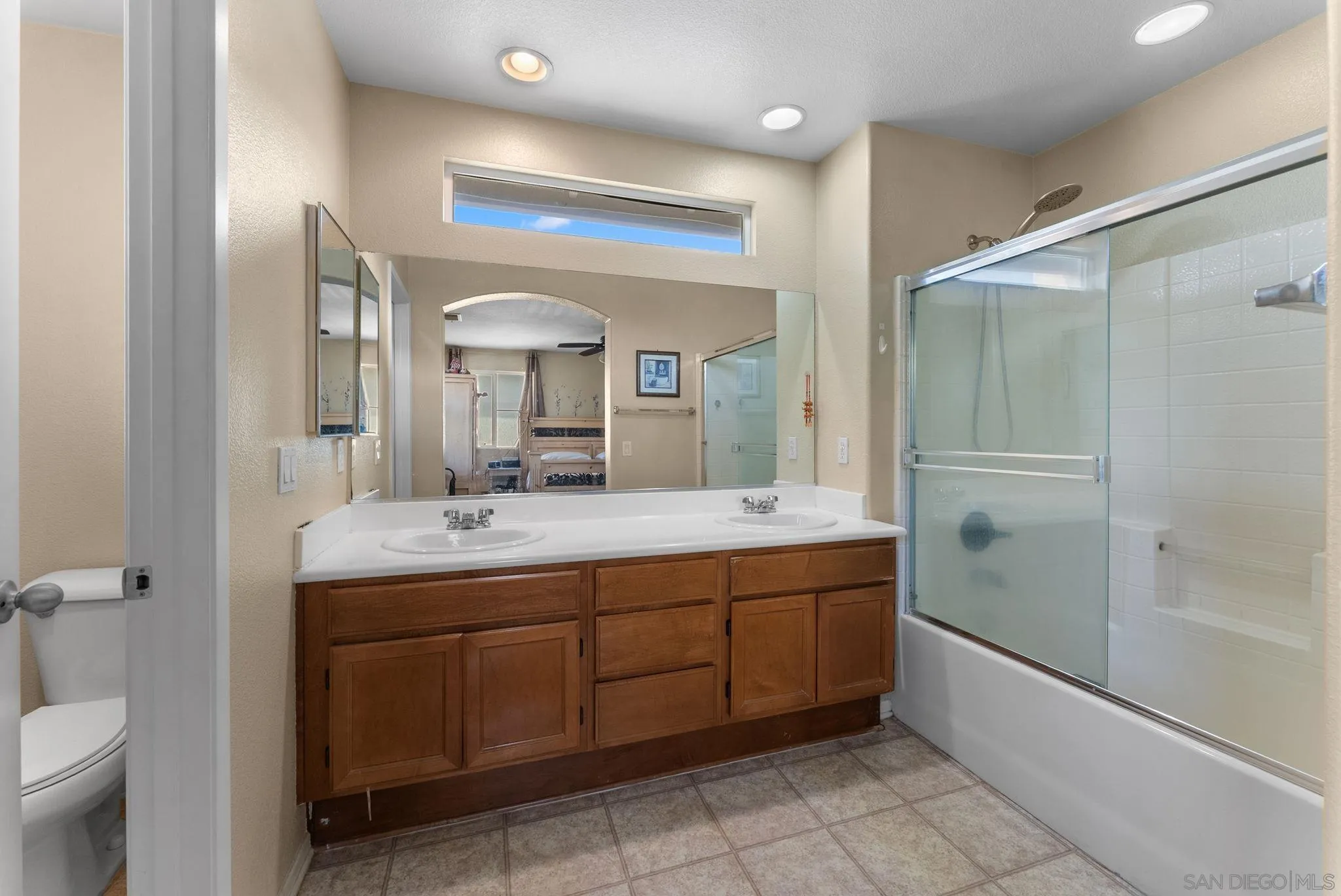 1924 Geyserville Street Chula Vista, CA 91913 - Photo 21 of 37 a spacious bathroom with a double vanity sink mirror and toilet