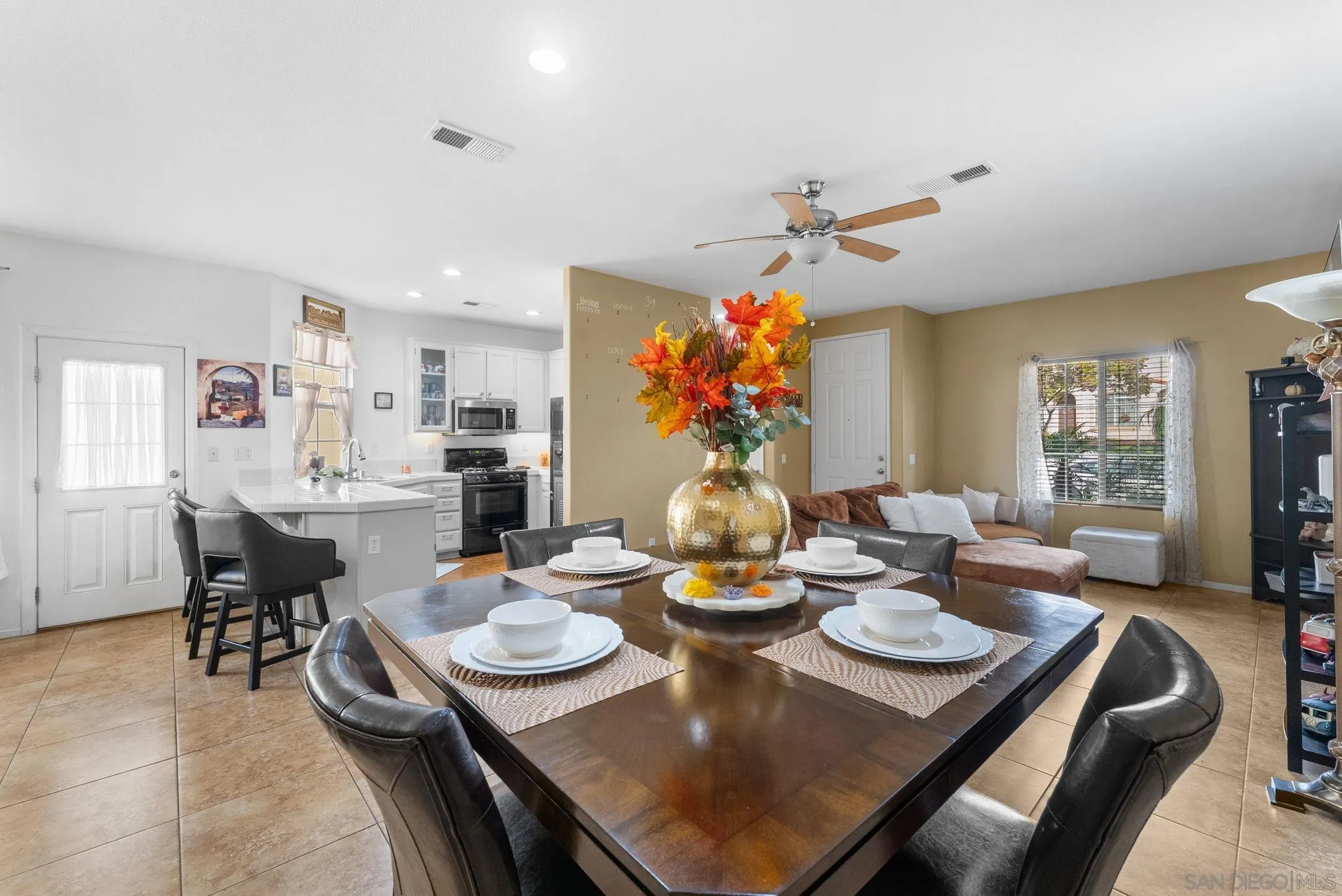 1924 Geyserville Street Chula Vista, CA 91913 - Photo 9 of 37 a view of a dining room and livingroom with furniture wooden floor a rug a chandelier