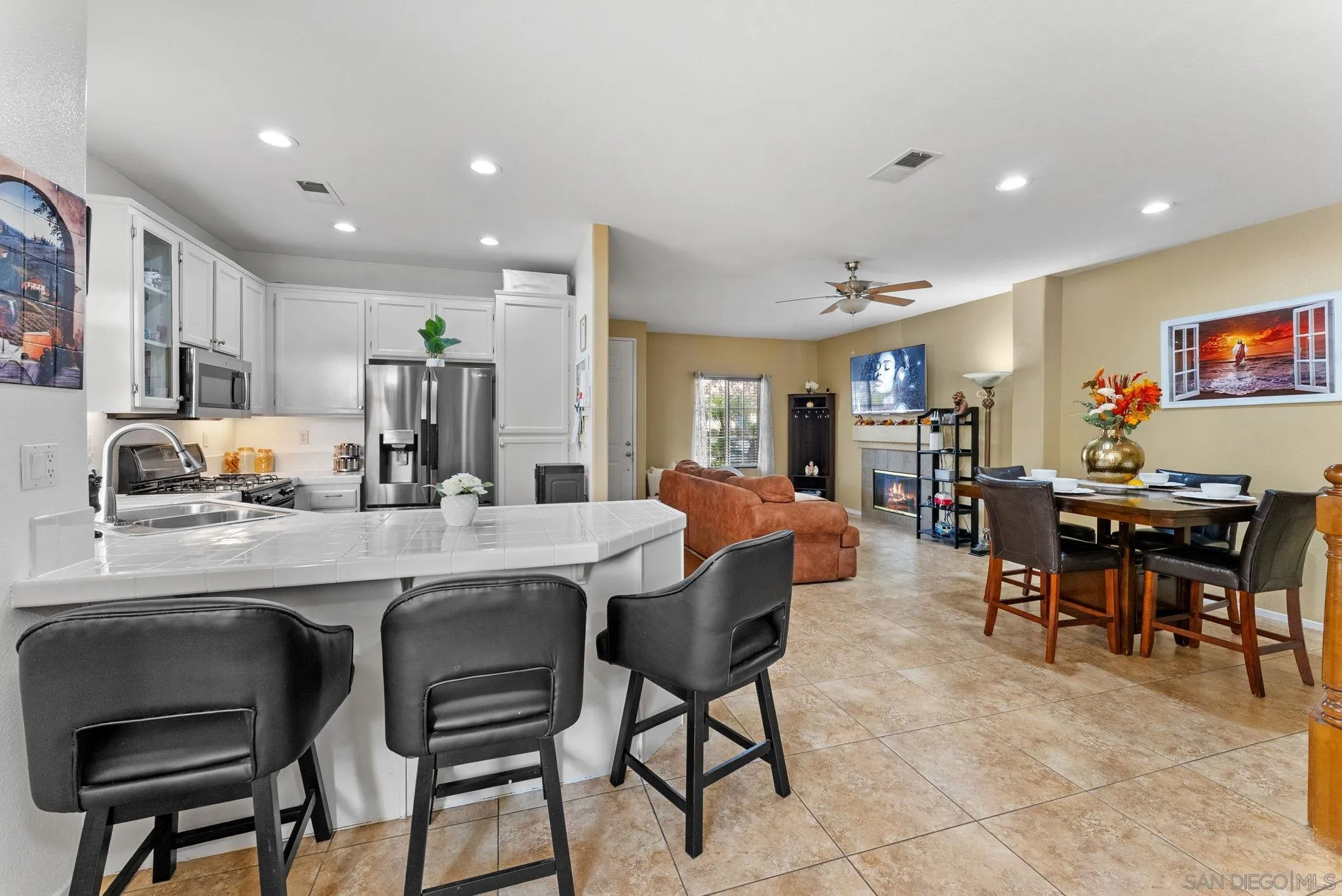 1924 Geyserville Street Chula Vista, CA 91913 - Photo 10 of 37 a living room with stainless steel appliances furniture a dining table and chairs