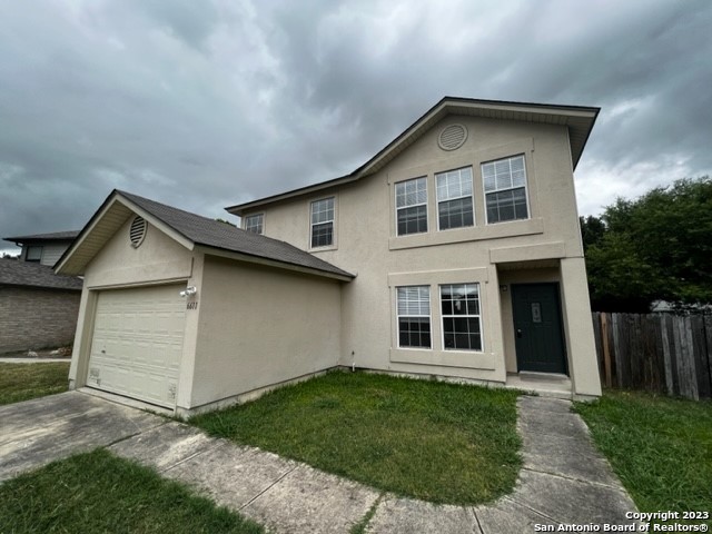 6611 Clouds Point Converse, TX 78109 - Photo 2 of 13 a front view of a house with a yard
