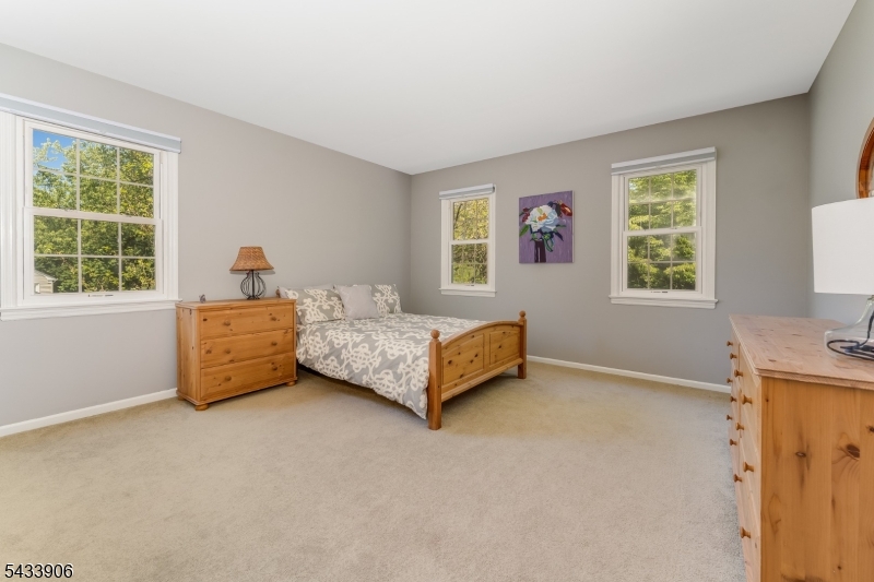 14 Lexington Road Annandale, NJ 08801 - Photo 29 of 47 a bedroom with a bed and a window