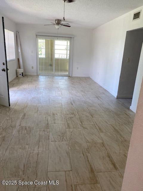 907 Espanola Way Melbourne, FL 32901 - Photo 2 of 7 wooden floor in an empty room with a window