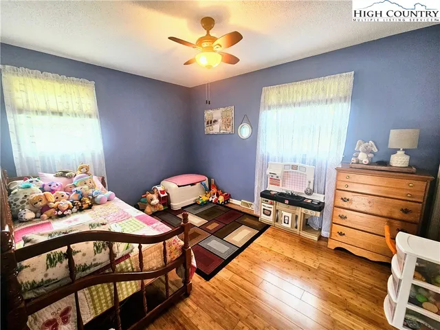 a bedroom with furniture and a window