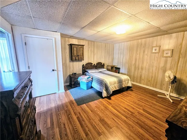 a bedroom with two beds and a dresser