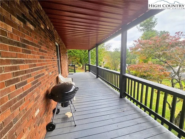 a view of a porch with wooden floor