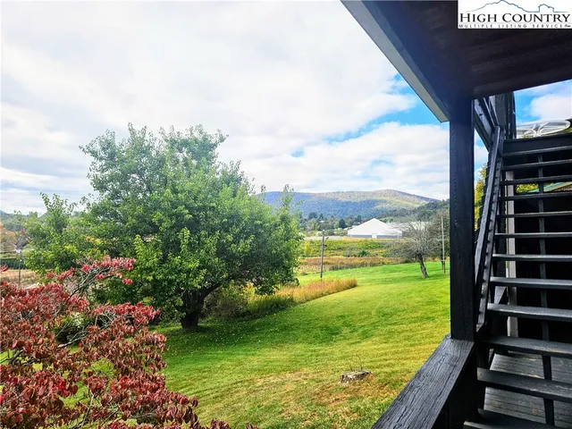a view of a garden from a balcony