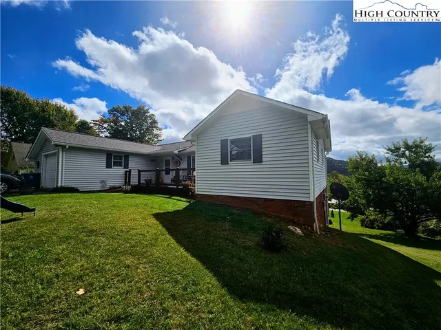 a view of a house with a back yard