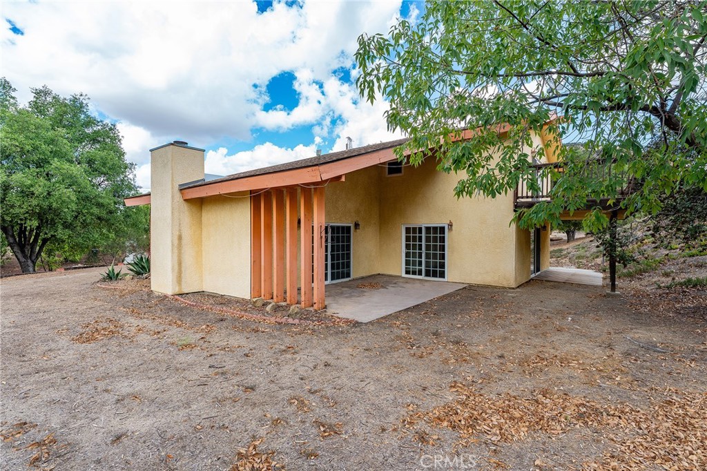 7254 Studio Road Canoga Park, CA 91304 - Photo 25 of 26 a view of a house with a yard and garage