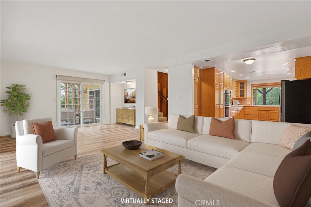 7254 Studio Road Canoga Park, CA 91304 - Photo 5 of 26 a living room with furniture a dining table and a large window