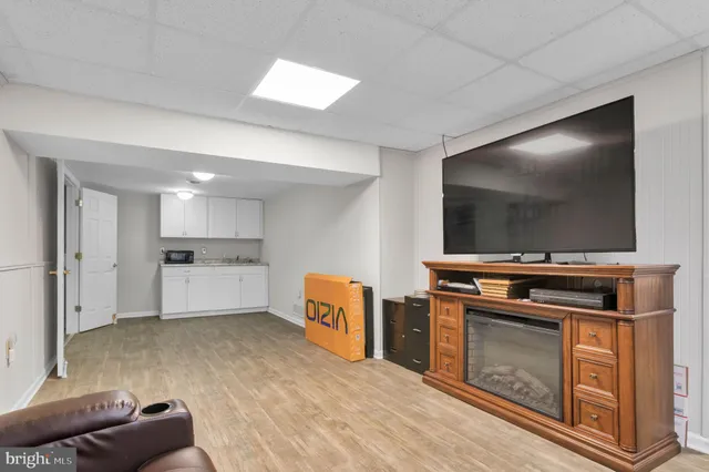 a bathroom with a tub sink and a mirror