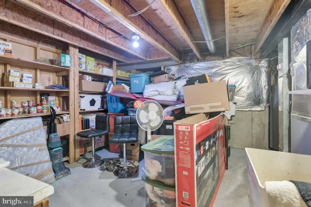 a view of a livingroom with furniture a ceiling fan and wooden floor