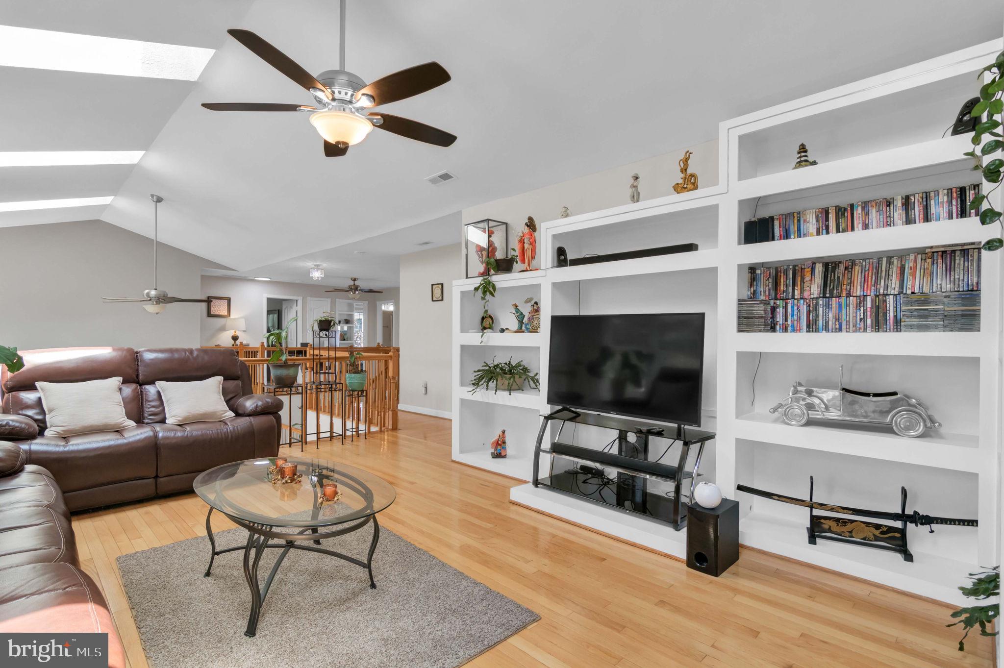 10404 Amherst Circle Fredericksburg, VA 22408 - Photo 34 of 74 a living room with furniture a flat screen tv and a fireplace